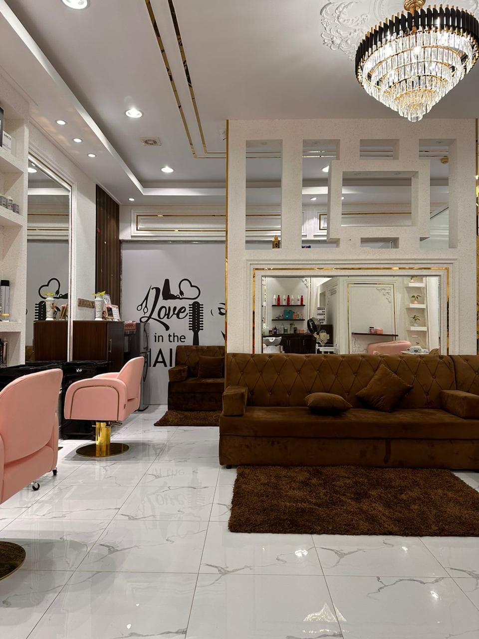 Styling chairs, chandelier, and mirror inside the salon